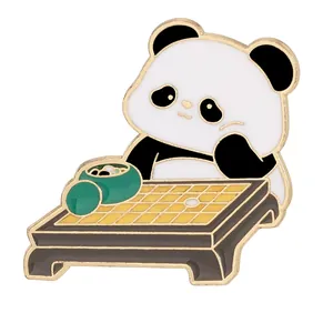 Cute cartoon panda enamel brooch playing Go chess in polished gold-plated metal finish