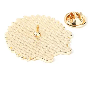 Golden metal hedgehog pin back view showing butterfly clutch and textured finish