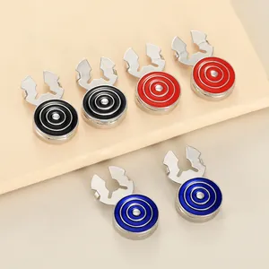 Macro shot of geometric round metal cufflinks in black, red, and blue with tiered design