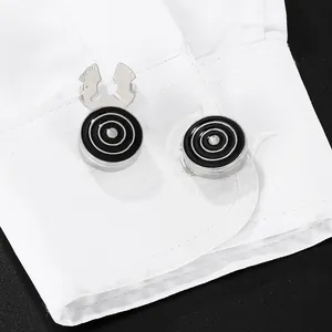 Mens business cufflinks with black enamel concentric circles on a white shirt cuff