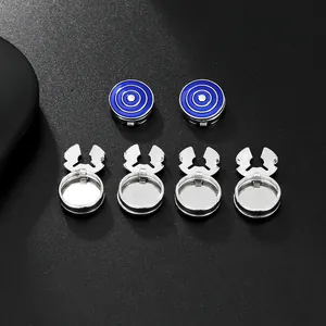 Detailed macro view of silver and blue target patterned metal button covers on black
