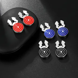 Macro detail of geometric round cufflinks with red blue and black enamel inlay