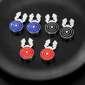 Macro shot of assorted round cufflinks in blue, black, and red with concentric texture