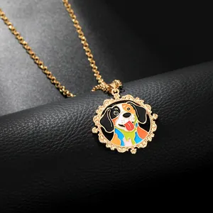 Macro view of golden round dog pendant with colorful enamel and carved floral edges