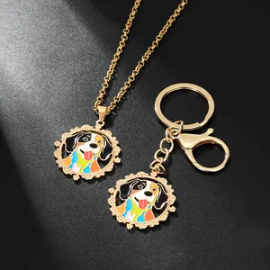 Detailed set of golden necklace and keychain featuring a colorful dog enamel pendant