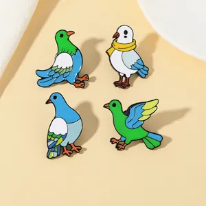 Detailed view of four colorful enamel dove pins in various artistic flying poses