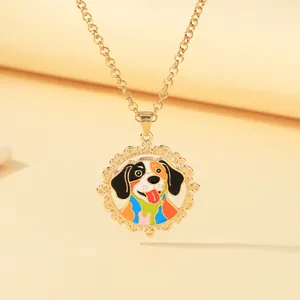 Detail of golden necklace with a colorful enamel cartoon dog pendant and filigree frame