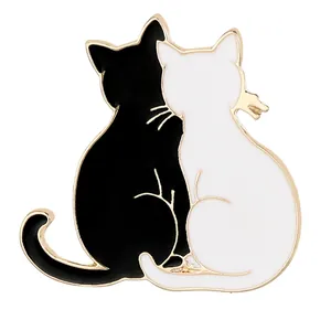 Cute black and white enamel cat brooch in zinc alloy with gold trim for clothing decoration