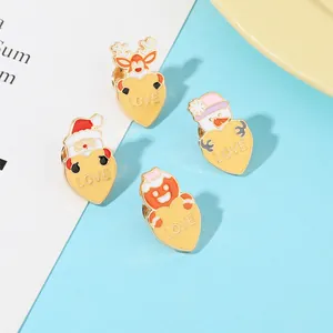 Detail showing colorful Christmas enamel heart brooches with gold plating and Love text