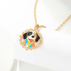 Detail showing a golden O-chain necklace with a colorful enamel dog pendant on a stand