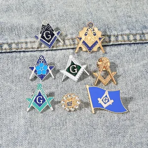 Set of Freemasonry enamel lapel pins with rhinestones and compass design on denim fabric