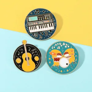 Set of three music themed enamel pins featuring a keyboard guitar and drum kit designs