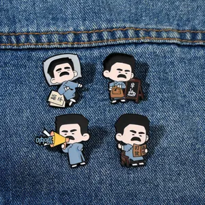 Detail of four Lu Xun cartoon enamel pins featuring modern social slogans on denim fabric