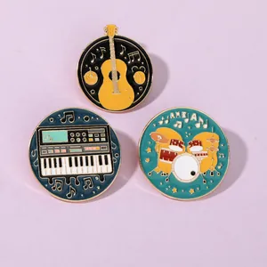 Detailed close-up of colorful guitar and drum set enamel pins on a lavender background
