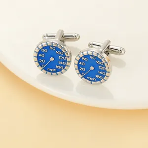 Detail view of silver speedometer cufflinks with blue enamel finish and mph scale