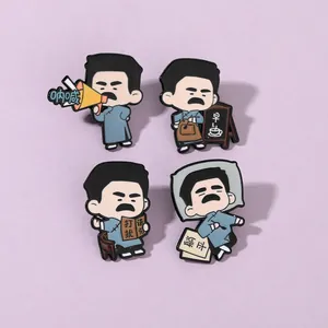 Detail of Lu Xun enamel pins featuring cartoon designs and Chinese character engravings