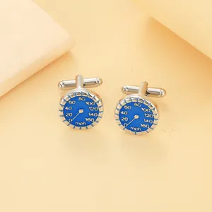 Macro shot of men's speedometer cufflinks with blue enamel dial and silver-tone T-bar