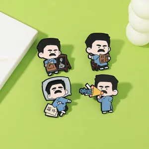 Detailed close-up of 4 Lu Xun cartoon enamel pins on a green surface with marble accent