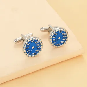 Macro detail of silver speed dial cufflinks with blue enamel finish and rotating clasp