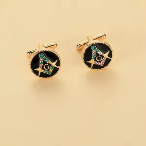 Detail showing gold masonry cufflinks with black enamel and colorful crystal stones