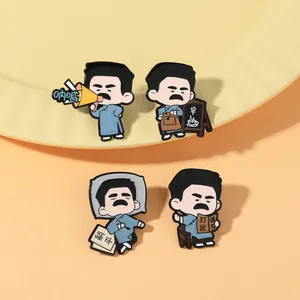 Detailed close-up of four literary cartoon enamel pins on a warm decorative plate