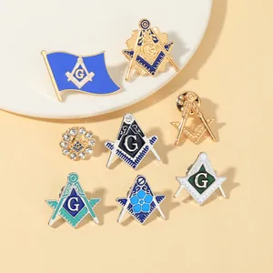 Detailed close-up of Masonic pins featuring compass and square with blue enamel and rhinestones