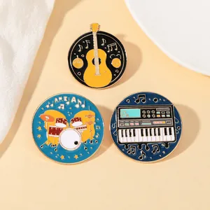 Detailed view of guitar drum and keyboard enamel pins with gold metal finish