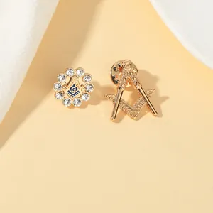 Detailed view of Masonic Freemason pins with golden plating, blue enamel, and sparkling rhinestones