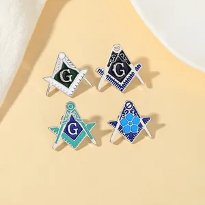 Macro view of four Mason badges with square and compasses design and enamel finish
