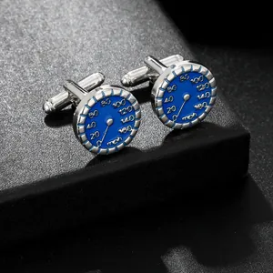 Close-up of blue enamel cufflinks featuring a detailed car speedometer design in silver