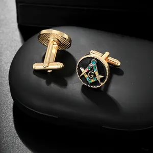 Golden Masonic cufflinks with black enamel, G-symbol compass, and colorful rhinestones