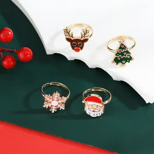 Detail of Christmas ring set with Santa, reindeer, and snowflake motifs in gold finish