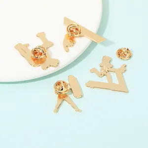 Set of four gold fitness brooches featuring running and yoga silhouettes on a blue background