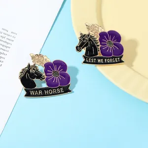 Detail of War Horse enamel pins with purple poppy flowers and Lest We Forget text