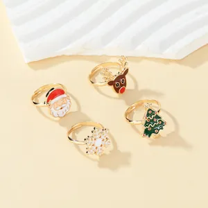Detail view of 4-piece Christmas ring set with Santa, Reindeer, Tree and Snowflake