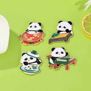 Detailed view of four enamel panda pins showing mahjong, hotpot and tea scenes
