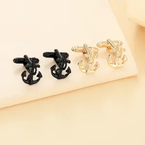 Macro detail of nautical anchor cufflinks in polished gold and black finish
