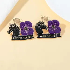 Detail of enamel pins featuring a black horse, purple poppy, and Lest We Forget engraving