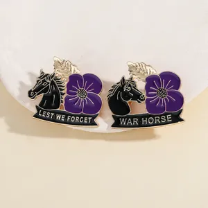 Detailed close-up of Lest We Forget War Horse purple poppy enamel pins on a stone pedestal