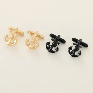 Detailed view of anchor cufflinks in gold and black finishes with rope texture detailing