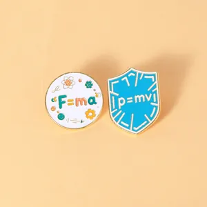 Detail of metal enamel pins featuring physics formulas F=ma and p=mv for backpacks