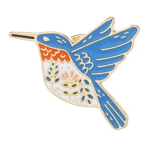 Colorful hummingbird enamel brooch pin with floral patterns in gold-plated alloy