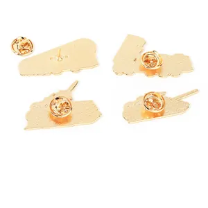 Set of four gold-plated tank metal pins showing the back side and butterfly clutches