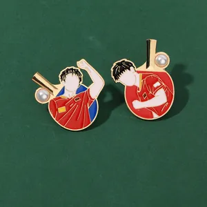 Detail of enamel table tennis pins with athletes silhouettes and faux pearl accents