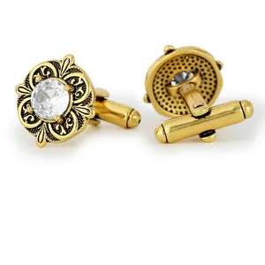 Vintage style gold cufflinks with sparkling round zircon in a baroque floral relief design