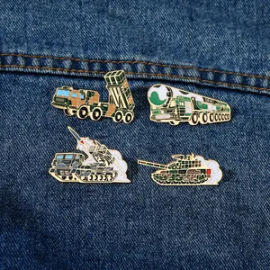 Detailed view of four military enamel pins including DF-41 missile on denim background