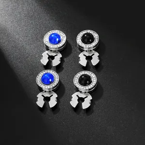 Macro shot of silver cufflinks set with deep blue and black rhinestones for shirts