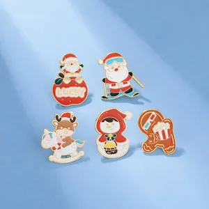 Detailed view of 5-piece Christmas enamel pin set featuring Santa, snowman and gingerbread man