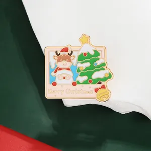 Detailed view of enamel Christmas Polaroid brooch with Santa, reindeer and golden bell
