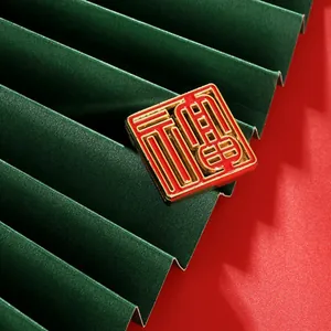 Detail of red and gold square magnetic Fu plaque featuring traditional Chinese carving